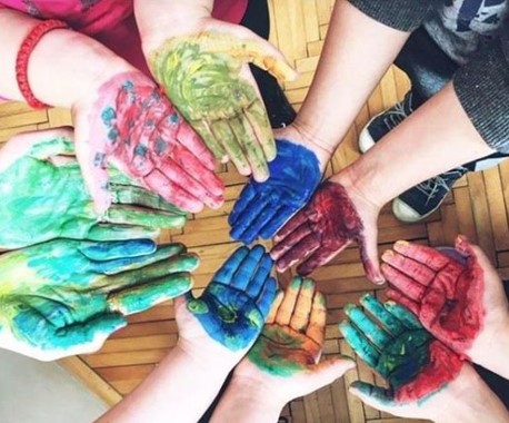 hands with coloured paint 